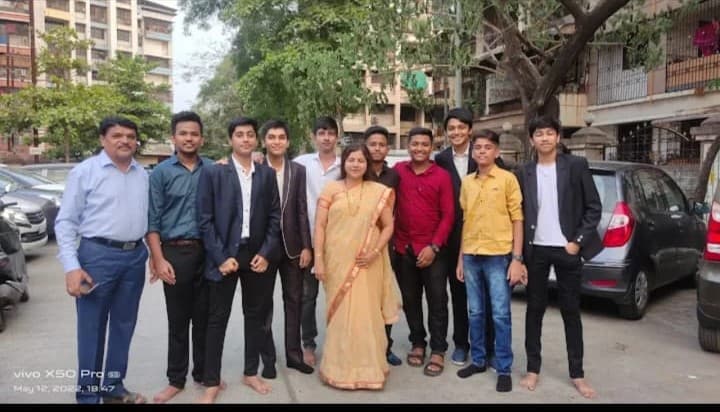 Teacher and students at Revi's Group Tuitions
